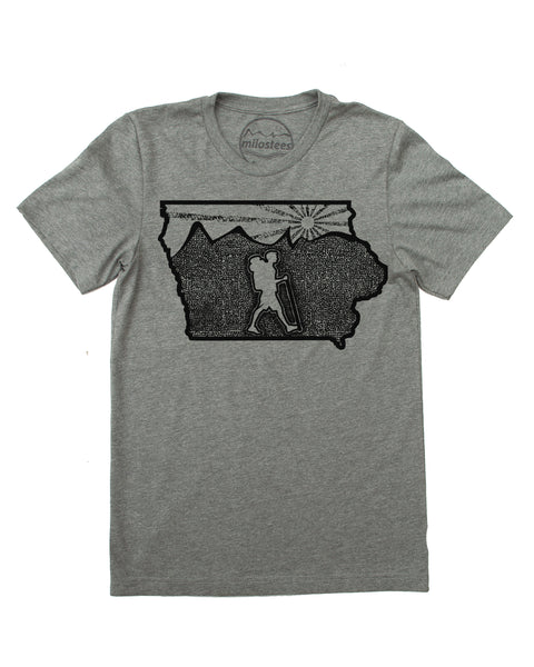 Iowa home shirt with original illustration of a hiker in the middle of the state surrounded by rolling hills and a setting sun. Cotton, polyester blend by Bella + Canvas in a grey hue. Print is black ink. $21.99, free shipping in USA. 