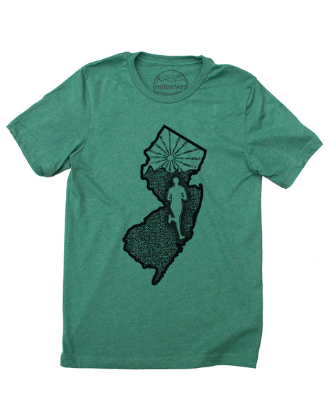 New Jersey home shirt with a runner illustration, runner inside the state outline, rolling hills and a setting sun also infill the state. Hand screen printed on a green hue in a cotton, polyester blend. $21.99, free shipping in USA. Elevate the day! 